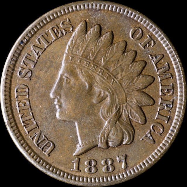 1887 Indian Head Penny cud error showing raised blob at rim where die fragment broke away leaving no design detail